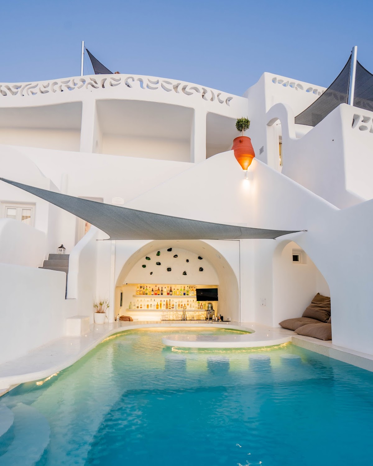 Athina Luxury Suites — boutique suites and restaurant wedding venue in central Fira, Santorini with caldera and volcano views, capacity for 80 guests
