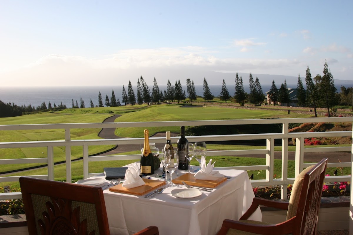 The Plantation House, Kapalua — dining terrace above the Plantation golf course with views to the ocean and Molokaʻi