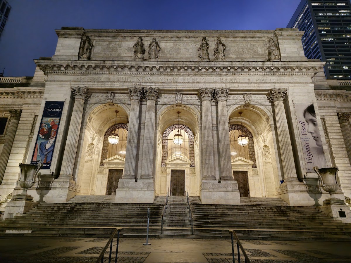 New York Public Library's Stephen A. Schwarzman Building — the marble Beaux-Arts facade on Fifth Avenue at dusk