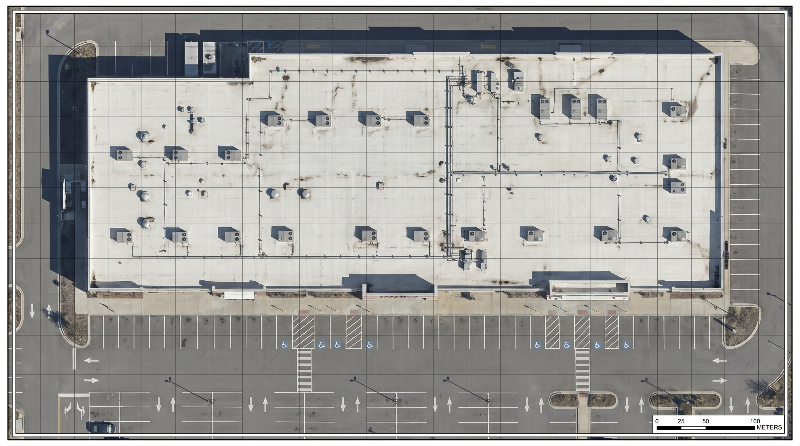 Robotic Imaging aerial drone orthomosaic mapping — top-down view of a commercial site showing rooftop equipment, parking lots and building footprint for as-built documentation
