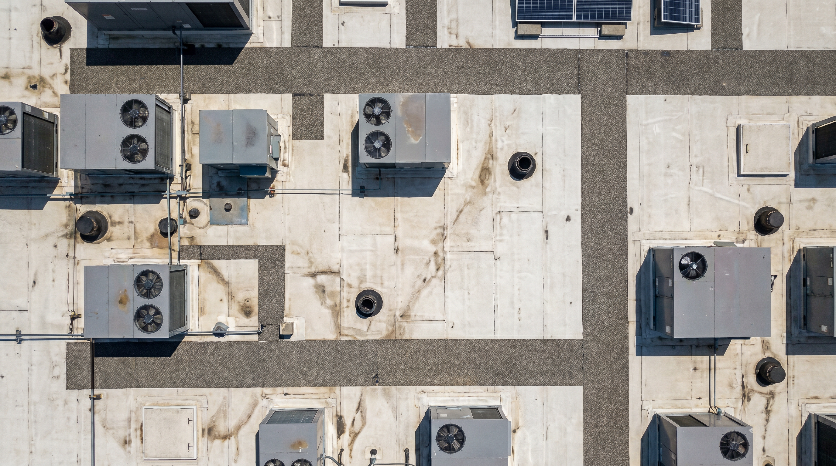 aerial drone orthomosaic map of commercial retail site rooftop — FAA Part 107 UAS pilot documentation showing HVAC units and roof conditions