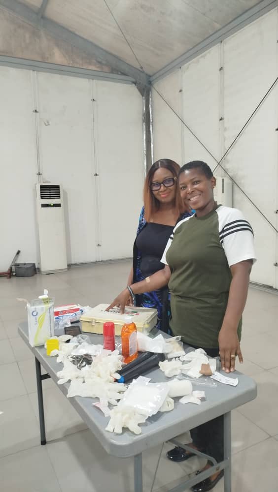 Instructor and trainee with emergency medical equipment setup