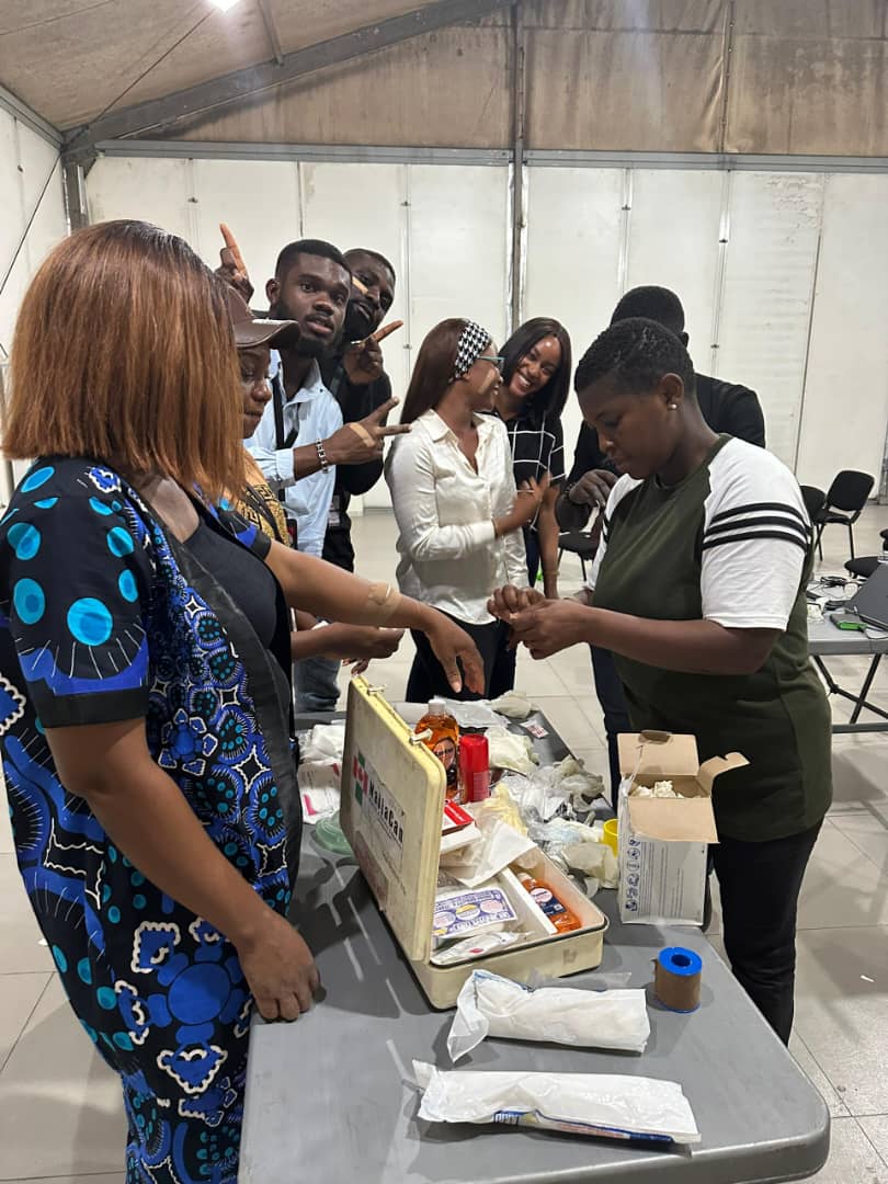 Trainees engaged in practical first aid and bandaging exercises