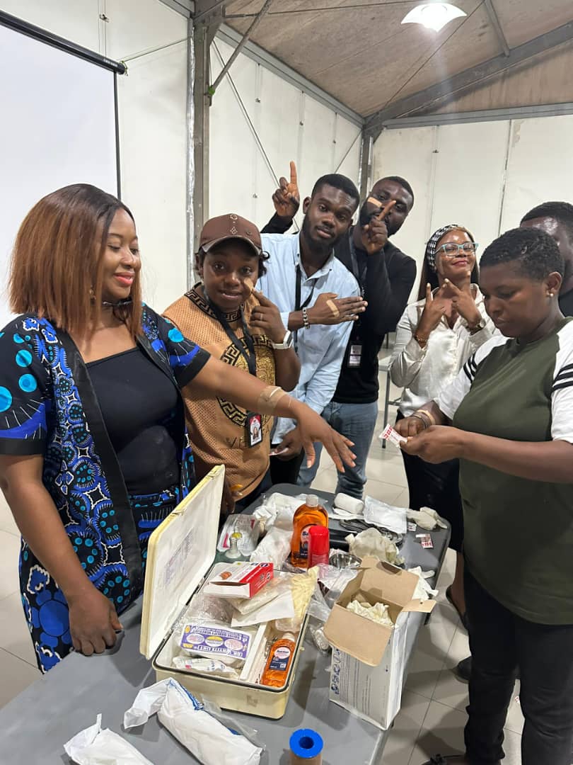 Trainees exploring first aid kit contents during practical session