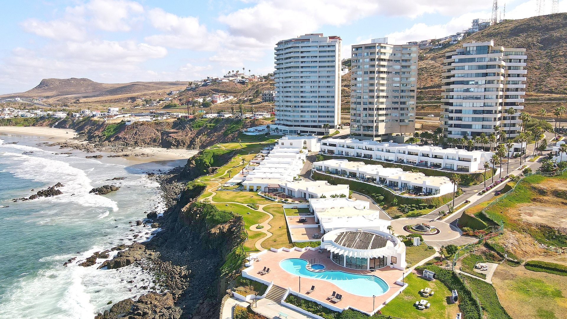 Beachfront home patio with hammock and turquoise Pacific Ocean in background in Rosarito Baja California