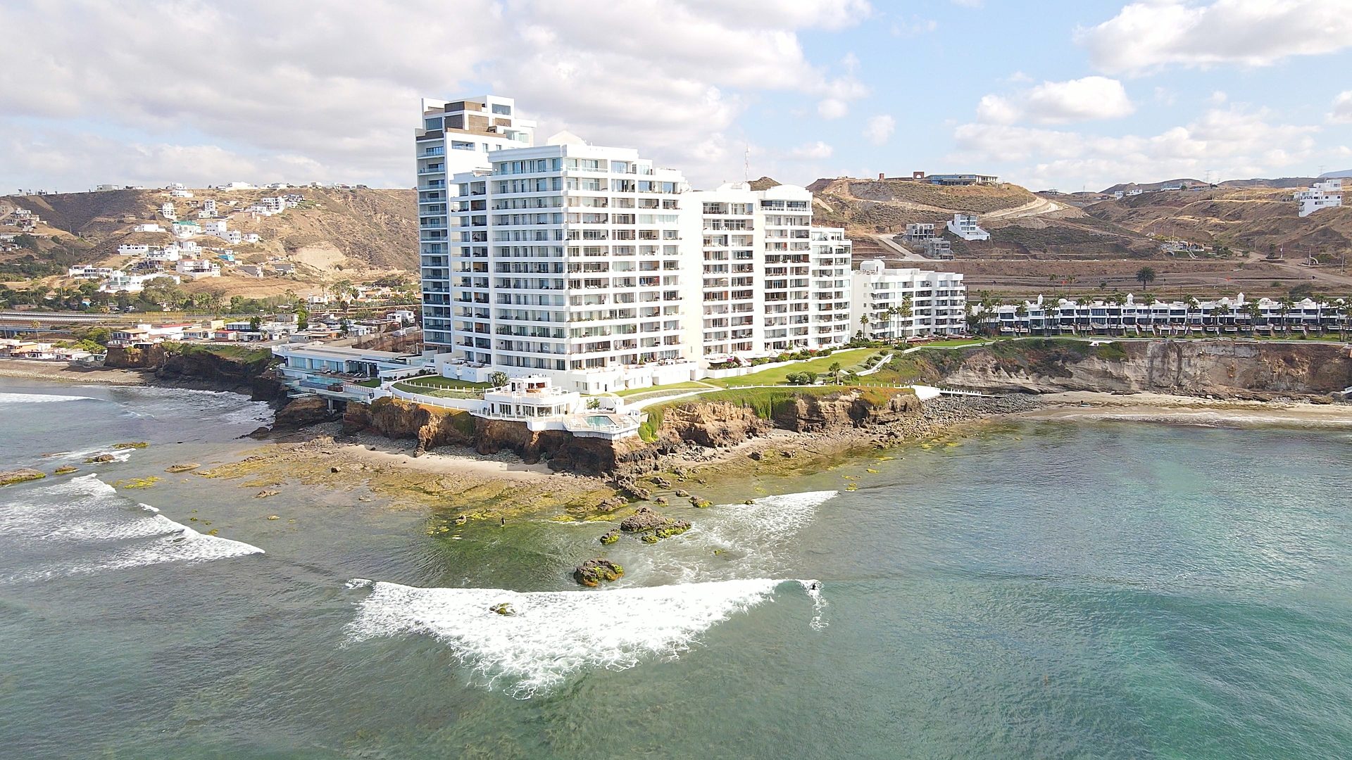 Aerial view of uncrowded K38 surf break at dawn near Rosarito Beach, Baja California