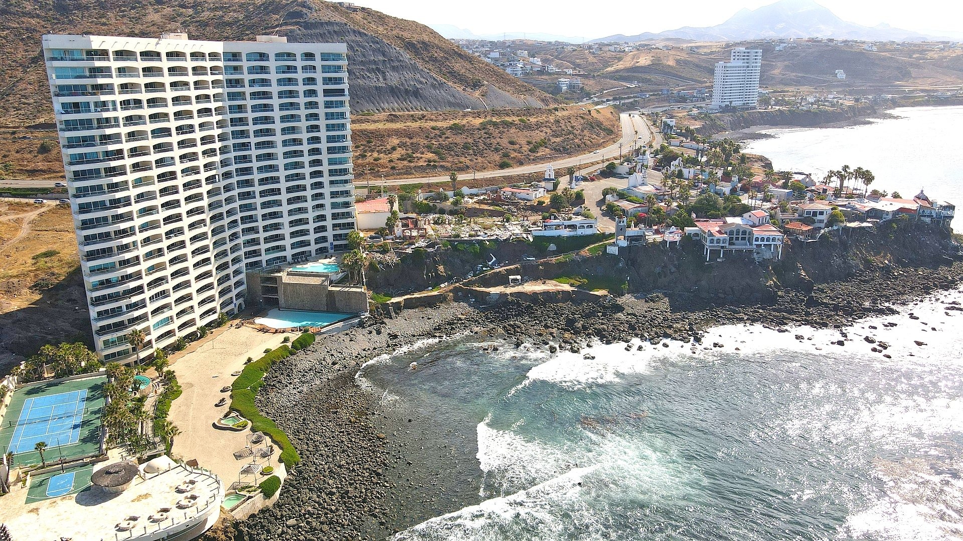 Buyer signing a beachfront property purchase contract in Baja California