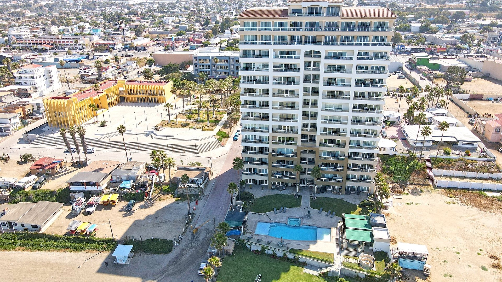 Oceanfront condo building exterior along the coast in Rosarito Beach, Mexico