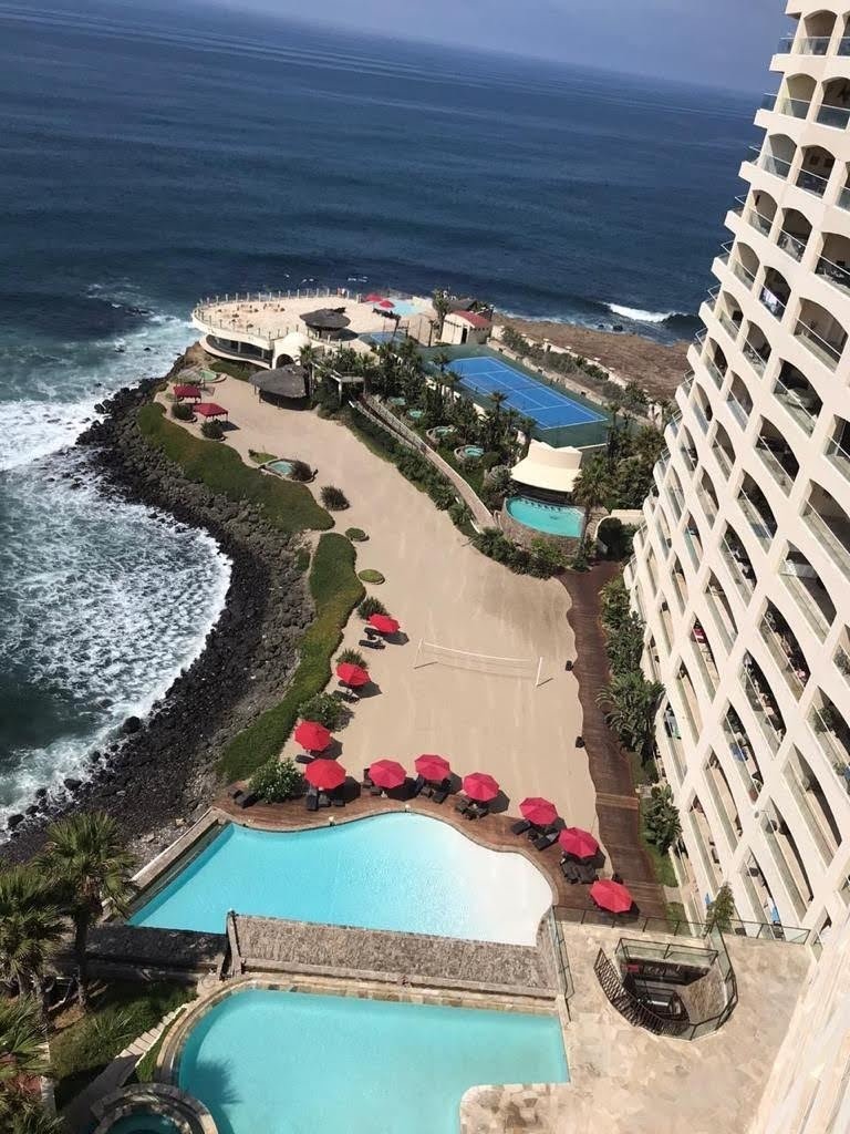 Condo balcony with ocean view furniture overlooking the Pacific coastline