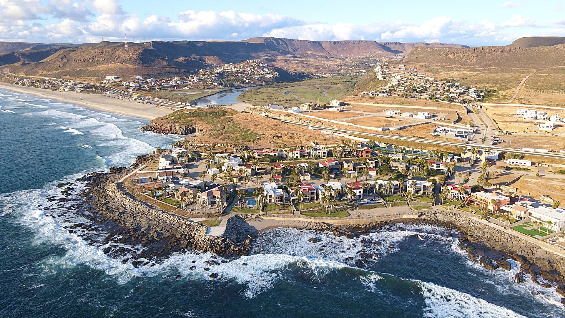 Rosarito coastal neighborhood with mixed housing types near the Pacific Ocean