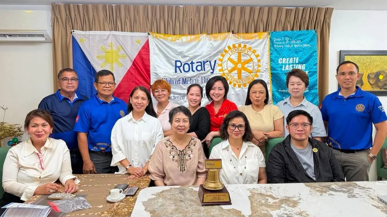 Club members and guests gather beneath the Rotary banner at the first club meeting of 2026–2027.