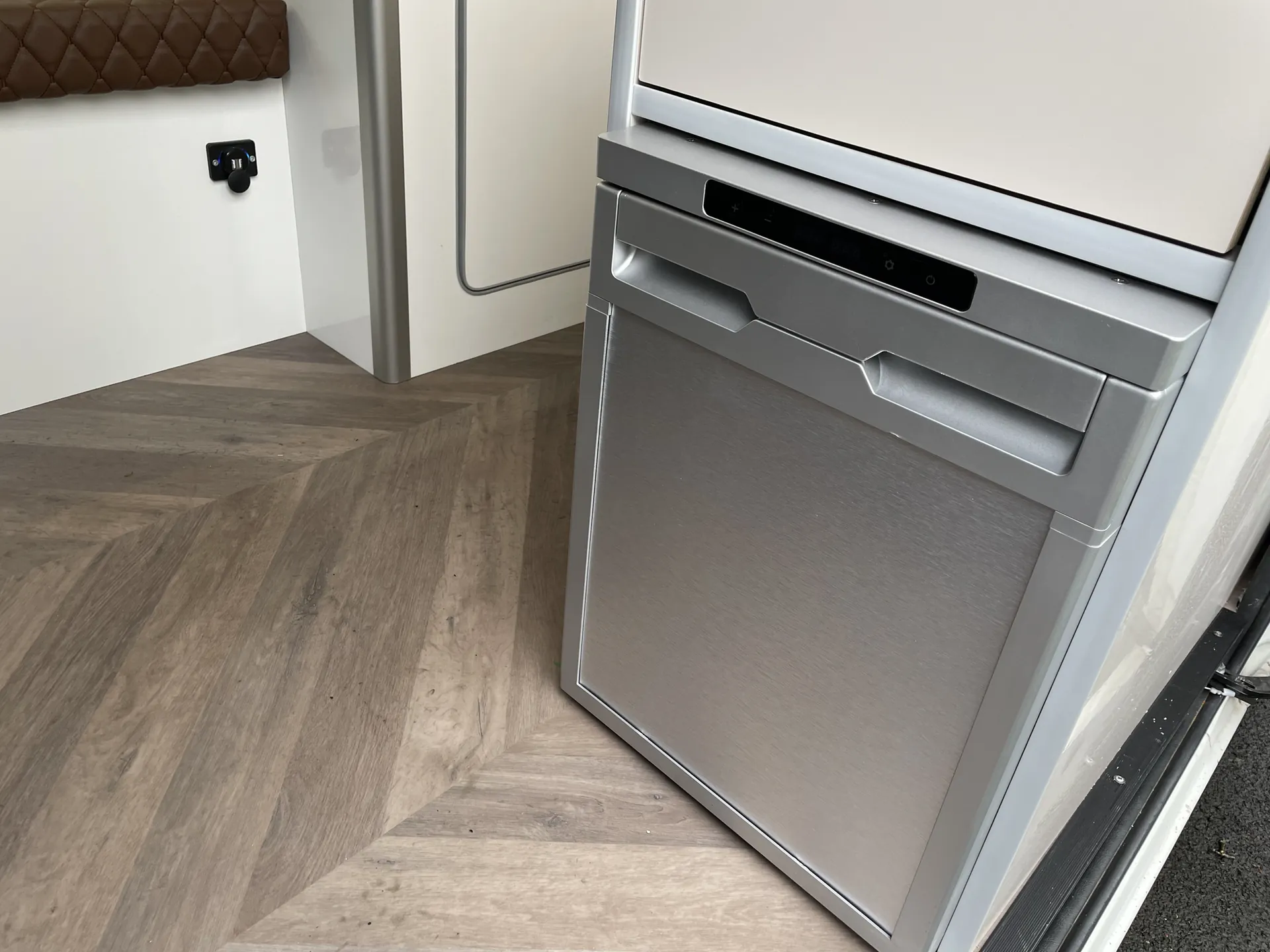 Fridge and freezer built into the cabinetry of a Peugeot Boxer conversion