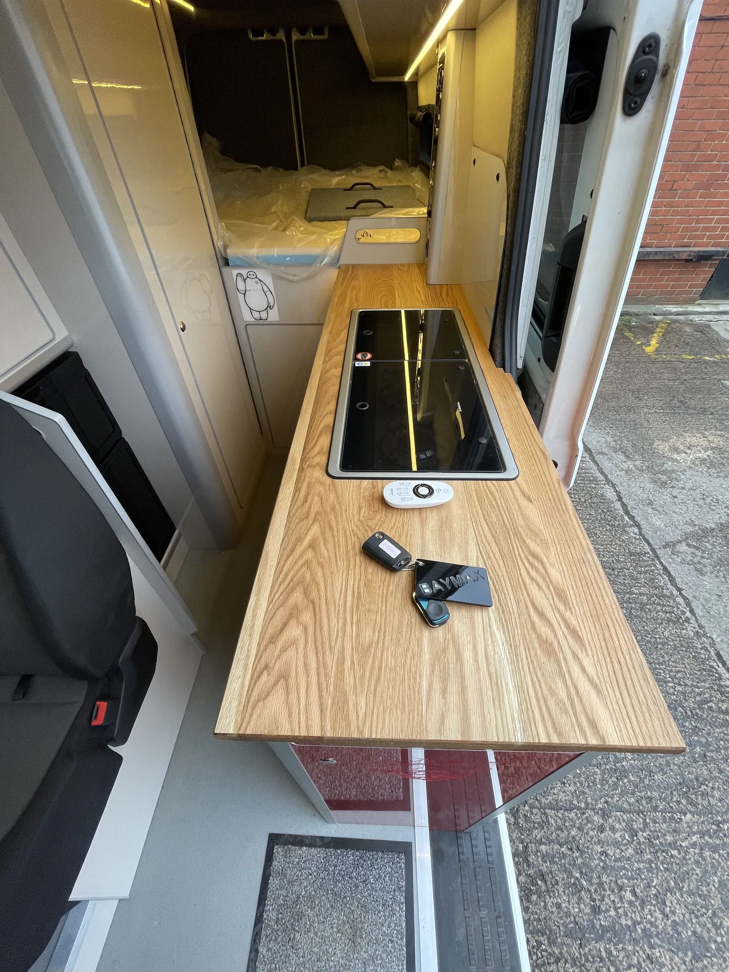 Oak worktop and sink seen from above in a VW Crafter campervan galley