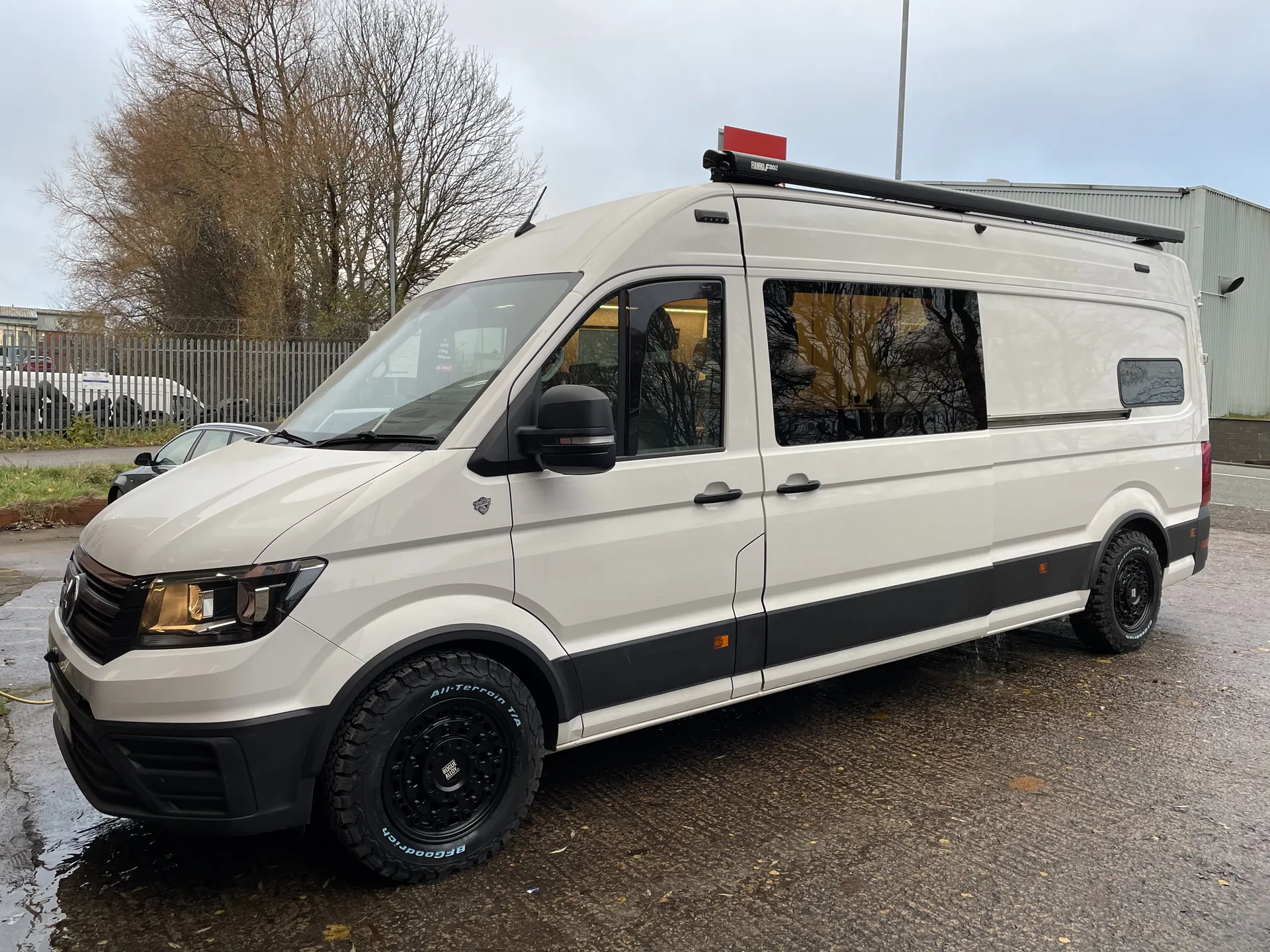 Side profile of a white VW Crafter LWB camper conversion