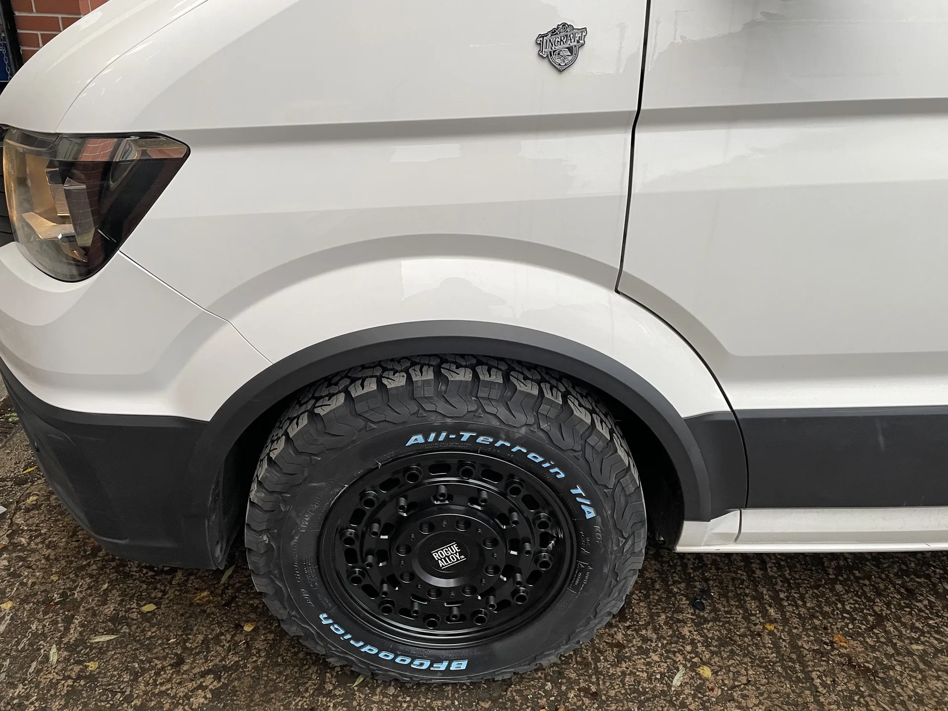 All-terrain tyre and Tincraft body badge on a VW Crafter camper