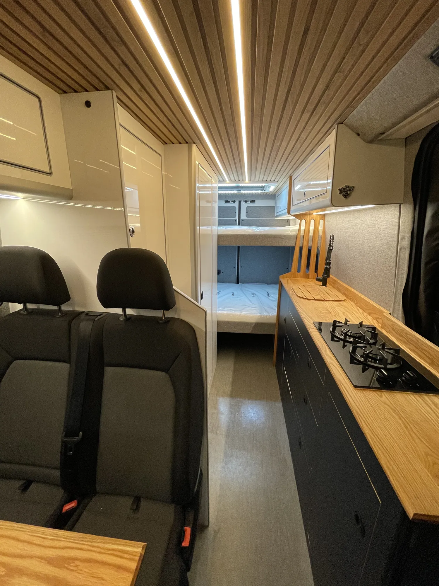 VW Crafter camper interior looking forward past the galley and seats