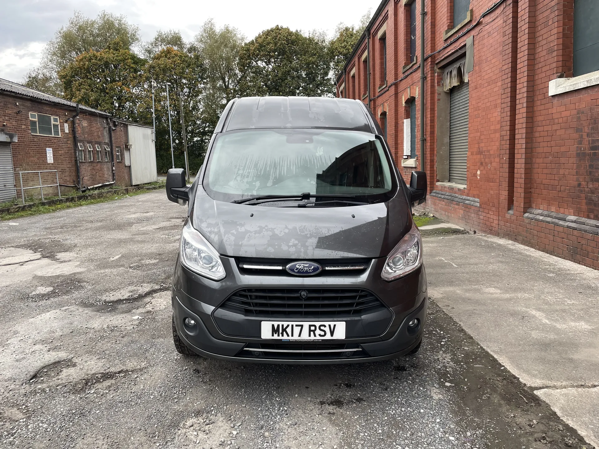 Graphite Ford Transit Custom campervan conversion, front three-quarter view