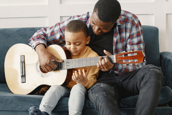 https://firebasestorage.googleapis.com/v0/b/safari-kids-dashboard.appspot.com/o/images%2Fblog%2F12_5_27_Father-and-son-playing-the-guitar.jpg?alt=media&token=aebf257f-87b4-4e0d-a81e-208d16fa8ca9