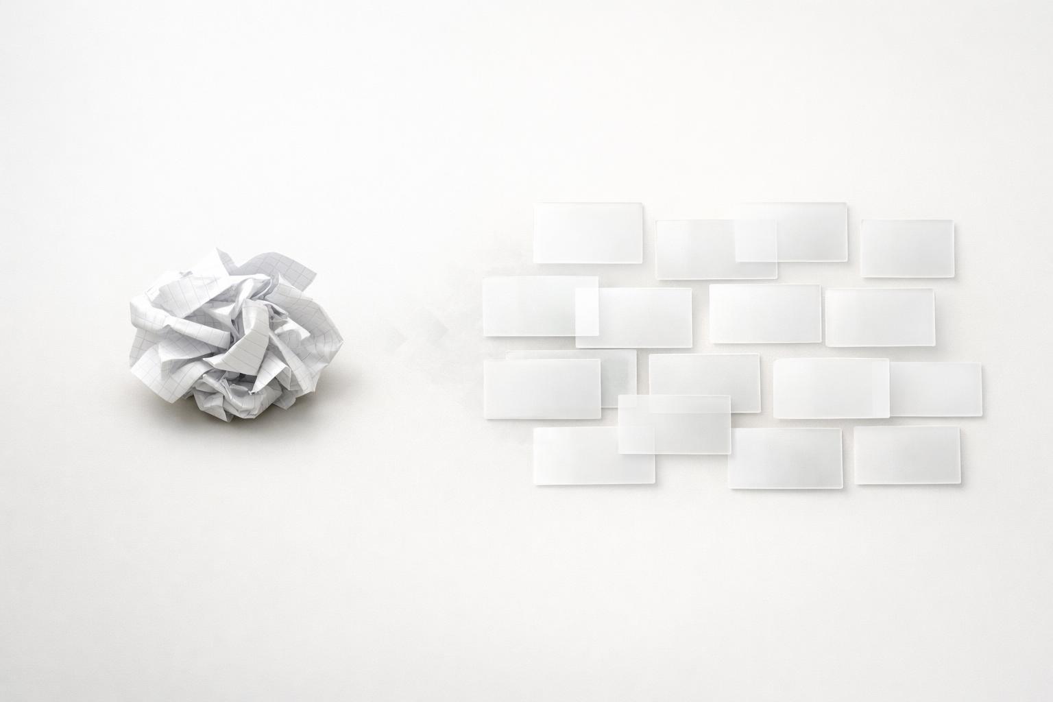 A tangled paper to-do list transforming into a structured grid of task cards