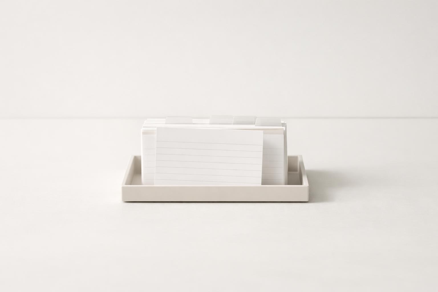 Index cards organized by life area, with one task card pulled forward for action