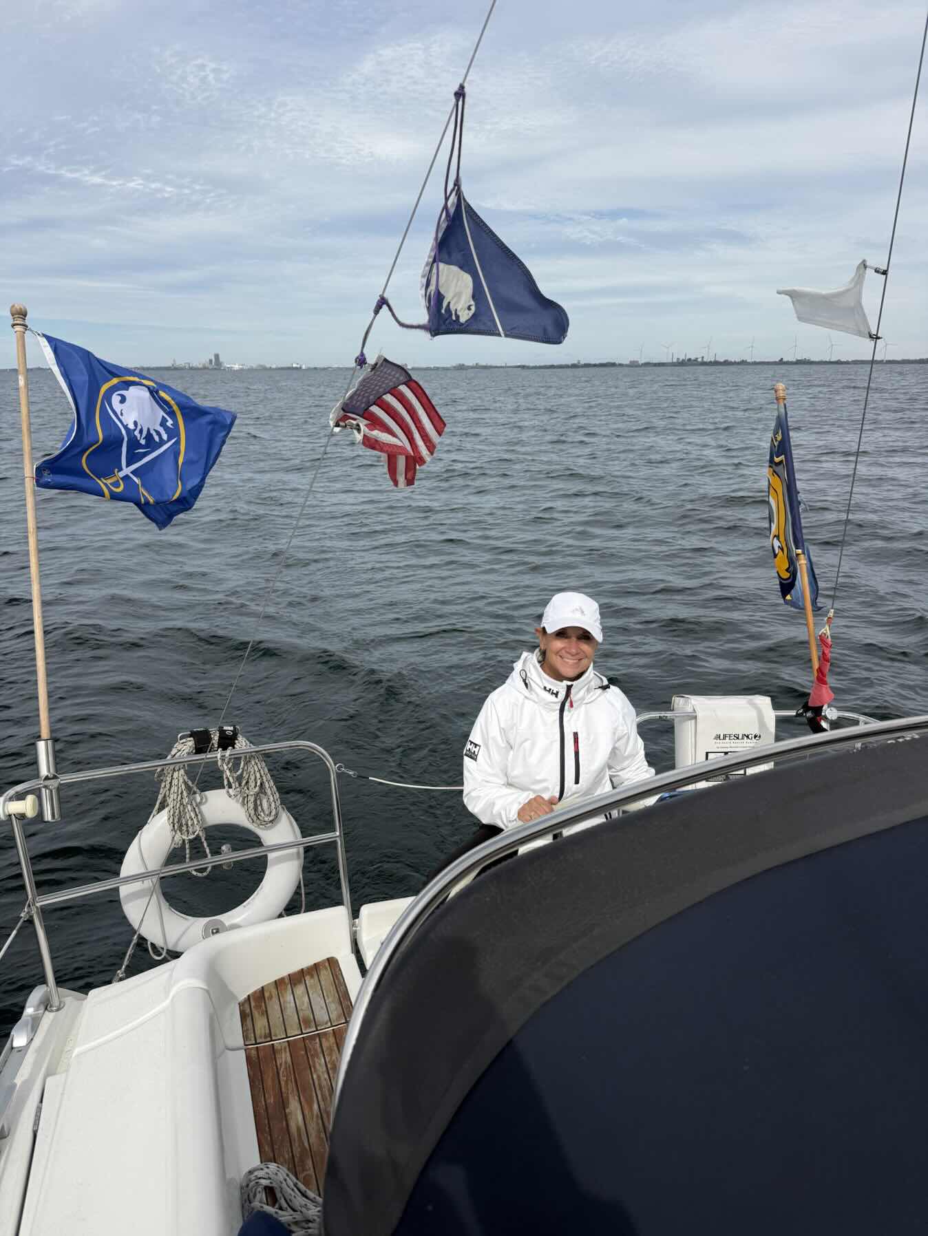 The Admiral on the Helm for a great fall sail_34FCB3F1-3766-4D15-B1B0-82F9F33170BC