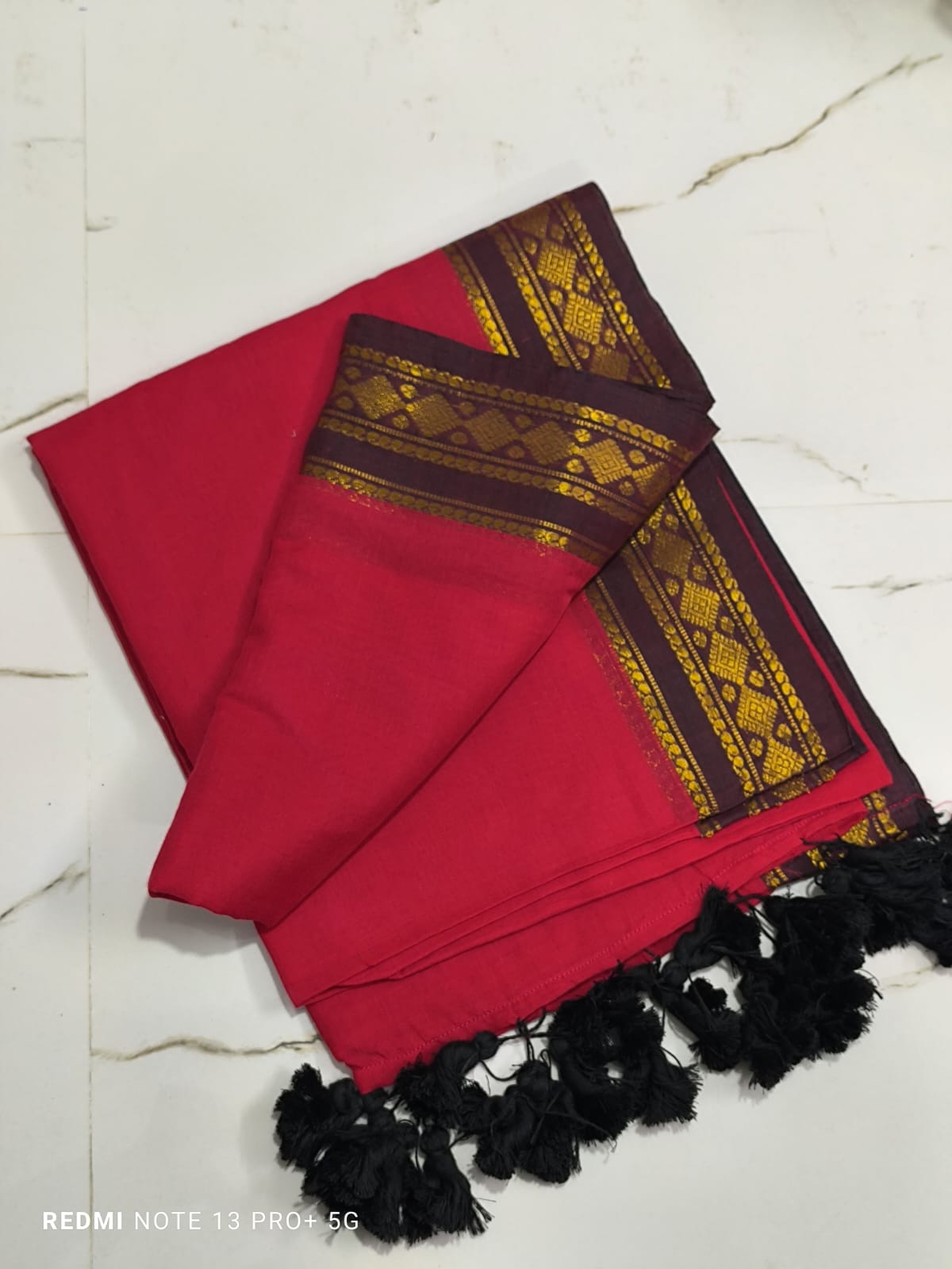 Vibrant Red Cotton Saree with Golden Geometric Border and Black Tassels