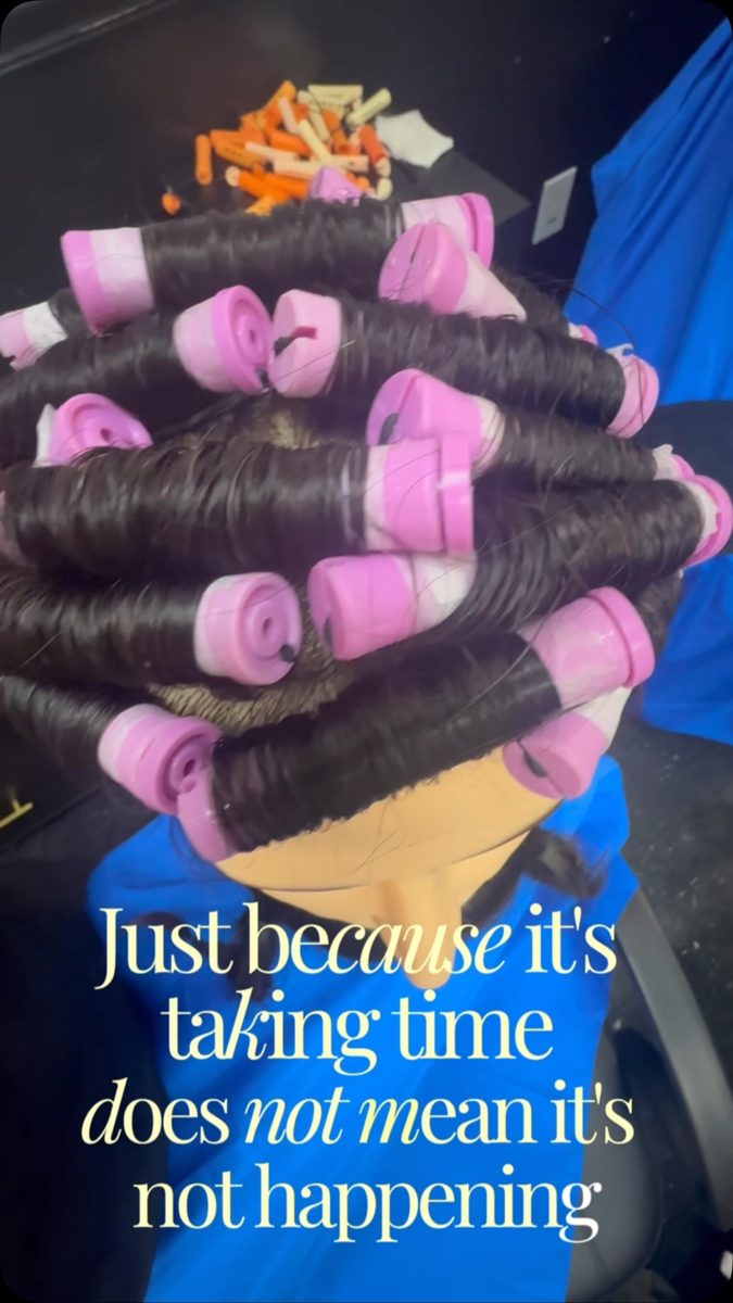 Pink perm rods with the caption “just because it’s taking time does not mean it’s not happening”