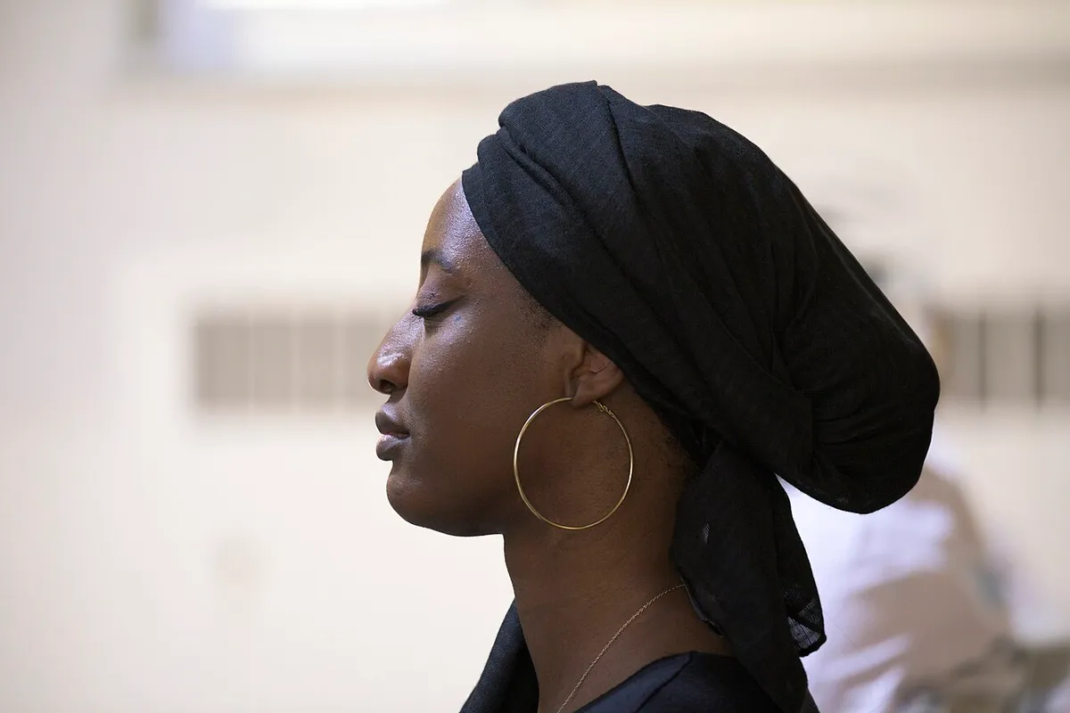 A person praying at Evangel Pentecostal Church in Quebec City, Canada