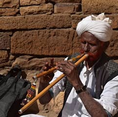 Folk musician playing traditional instrument