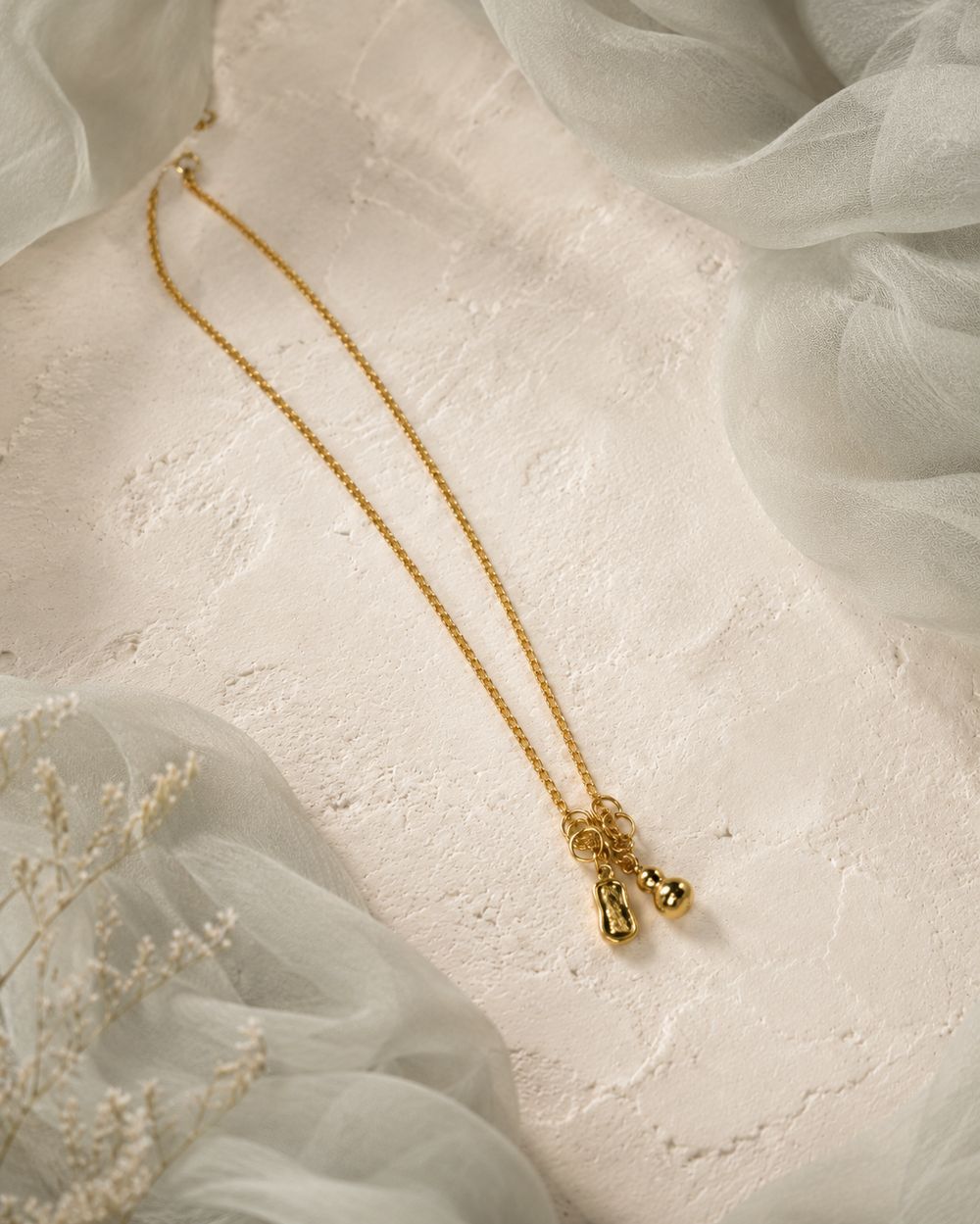 Golden Tassel Knot Pendant — view 1