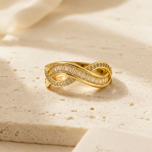 Infinity Twist Ring — 18k gold-plated · CZ