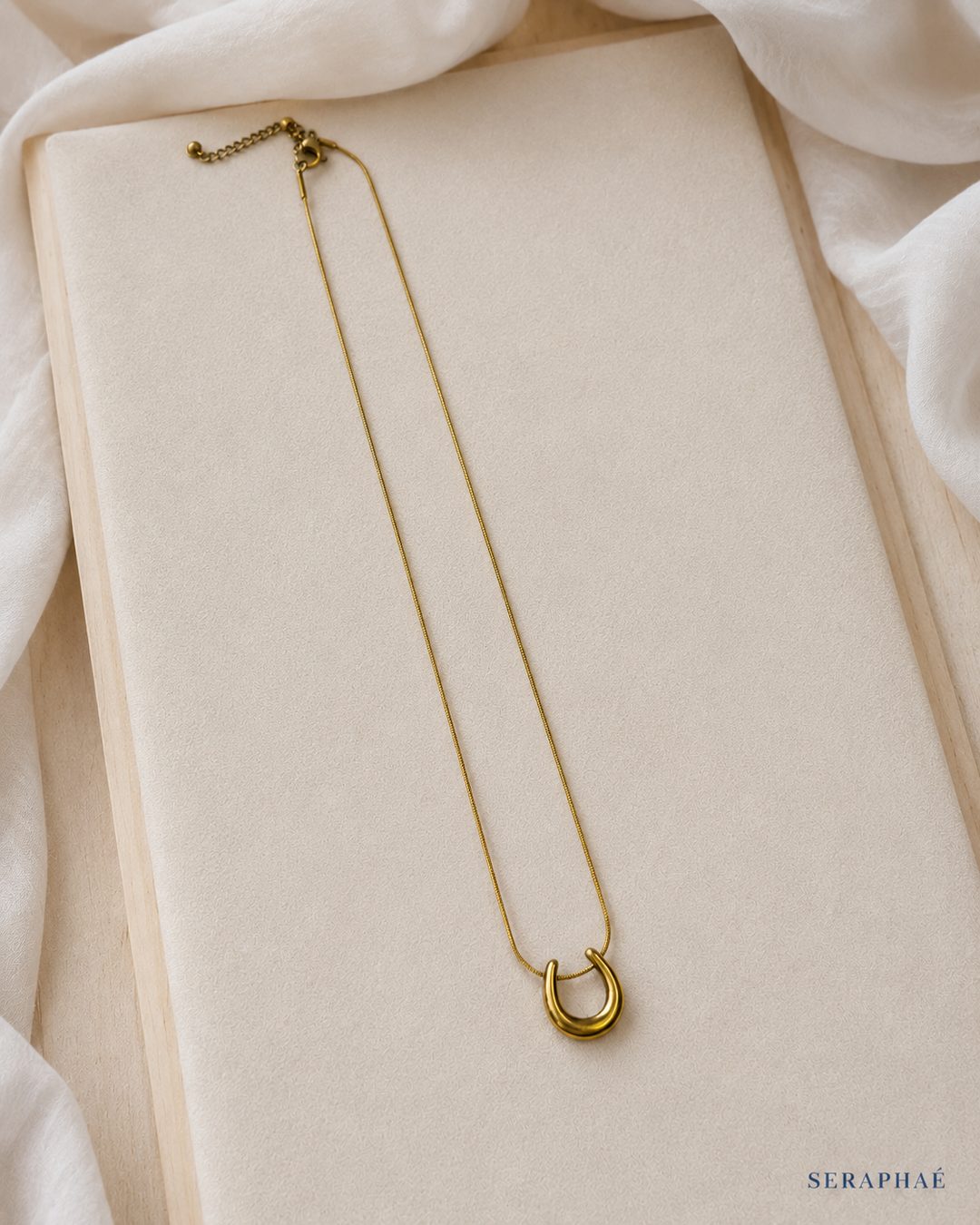 Horseshoe Pendant Necklace — 18k gold-plated · CZ