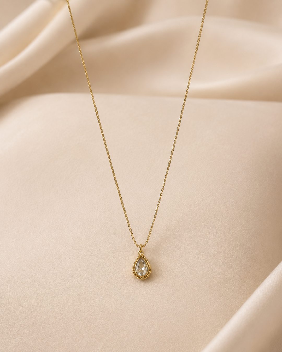 Teardrop Halo Necklace — 18k gold-plated · CZ