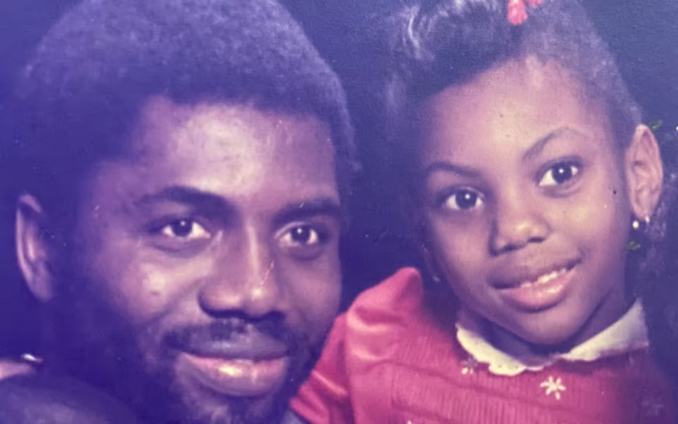 Kemi Badenoch as a child with her father, growing up in Nigeria where she witnessed at least two lynchings — including one where the victim appeared to be innocent.