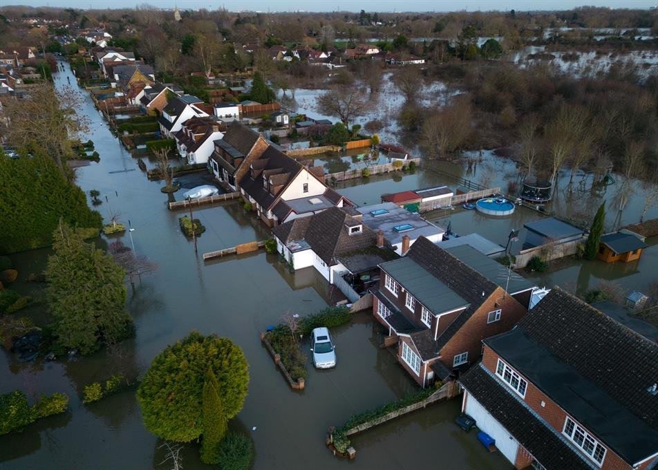 Residential streets submerged by floodwater, as the Financial Conduct Authority warns millions of homeowners' biggest assets are at risk from rising flood danger.