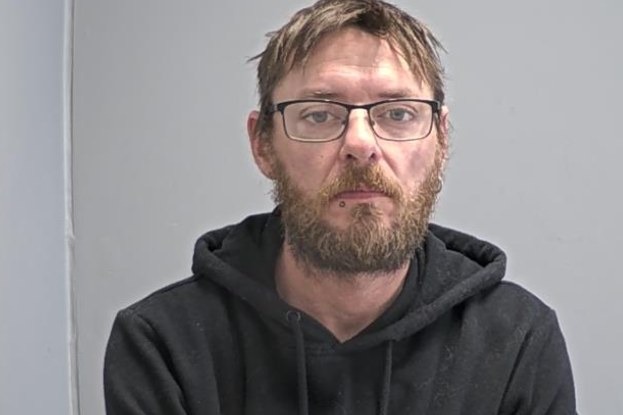Gaven Clarke, 41, in a police custody photograph, after forensic examination of his seized devices uncovered images of additional victims alongside hundreds of downloaded indecent images of children.