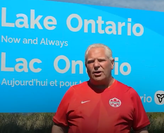 Doug Ford, dressed in a Team Canada soccer jersey, declared the lake's name would endure "long after President Trump is gone" as he unveiled the bilingual sign near Grimsby.