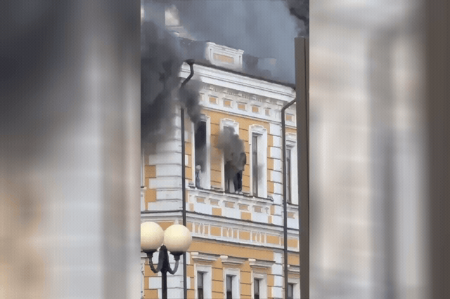 Smoke billows from Kyiv's National Academy of Sciences after a Russian drone strike that academy president Anatoliy Zagorodny called an attack on science, with staff forced to escape from upper-floor windows.