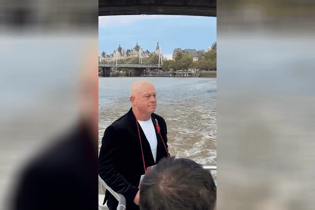 A rose left at a collecting stall, as Dame Elaine Paige recorded a special tannoy announcement for commuters marking London Poppy Day's 20th anniversary.