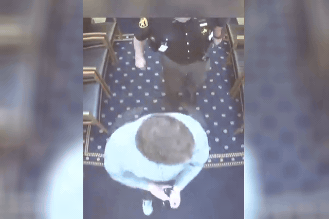 Timothy Reaggle on the floor of a hallway in Columbiana County Courthouse after being subdued — both bailiffs he attacked were hospitalised with broken bones before being discharged.