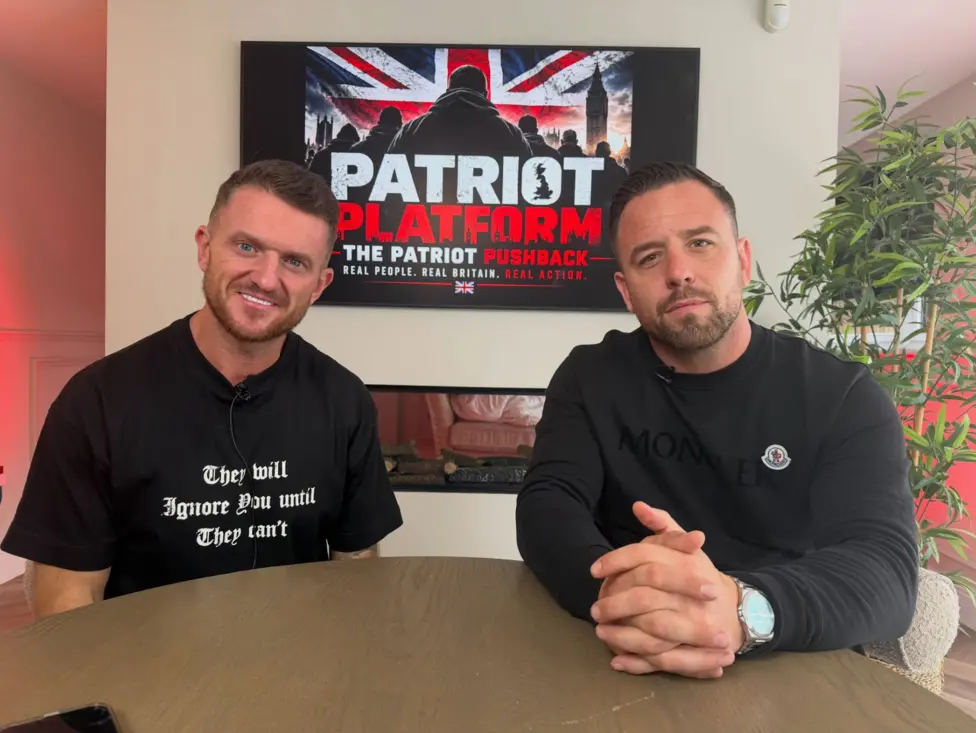 Tommy Robinson and Danny Thomas, whose Channel dinghy-slashing livestream Robinson publicly backed before Wednesday's counter-terrorism airport detention, which his barrister now claims was discriminatory.