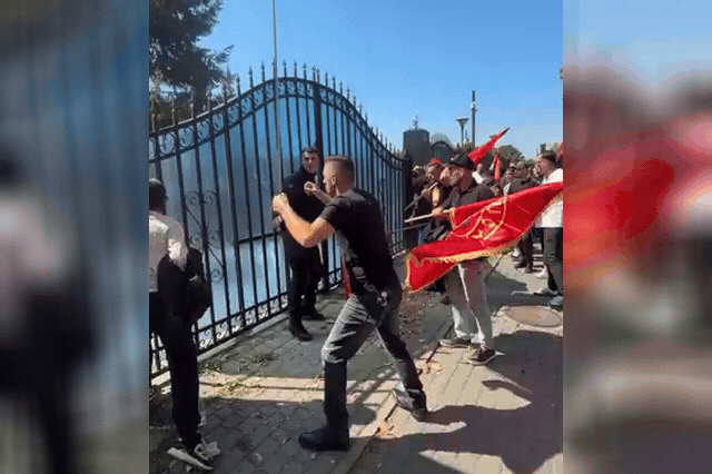 Protesters clash with riot police at a gate during demonstrations in which crowds stormed the EU Rule of Law Mission in Prishtina after Hashim Thaçi was handed a 25-year sentence.