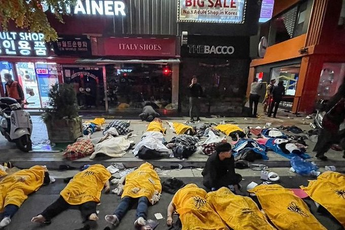 A crowd gathered in the narrow Itaewon street during Seoul's Halloween Festival in 2022, when a crush killed 158 people, with families warning survivors still living with trauma.
