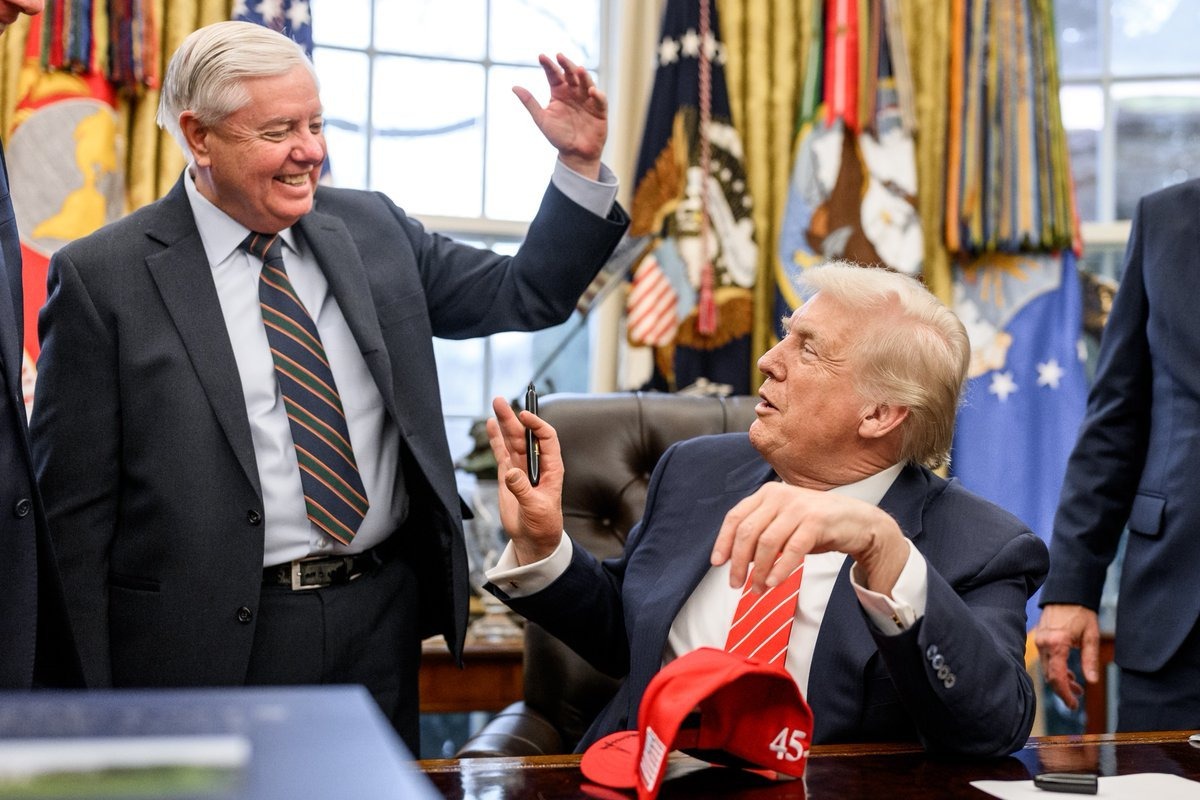 Donald Trump and Lindsey Graham. The legislation Trump signed bears the late senator's name after he championed it for more than a year before dying in July.
