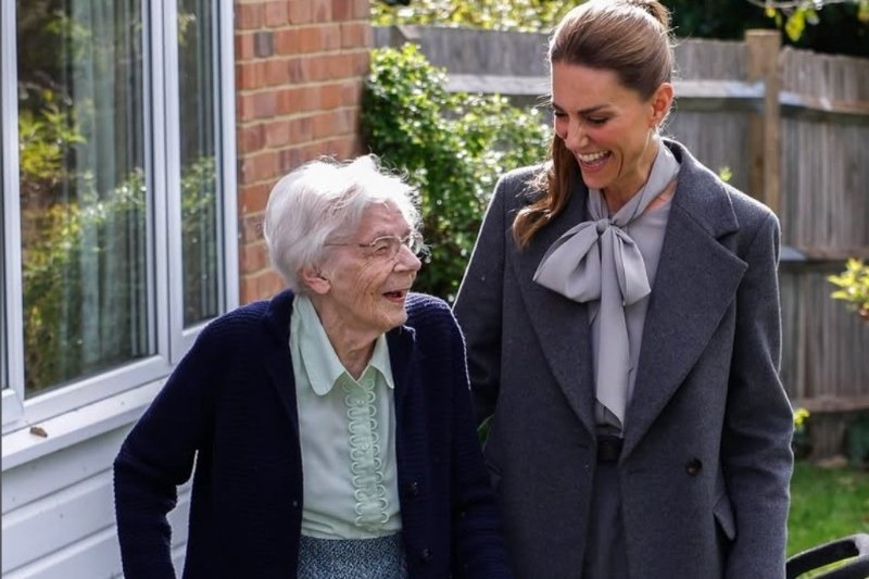 Catherine, Princess of Wales (right), who travelled to Pulborough Village Hall by volunteer minibus, delighting elderly lunch guests with the revelation that she and Prince William share the washing-up.
