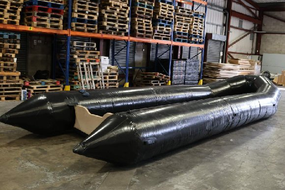 One of the 25 large inflatable boats seized by the National Crime Agency at East Midlands Airport, each capable of carrying dozens of migrants across the Channel.