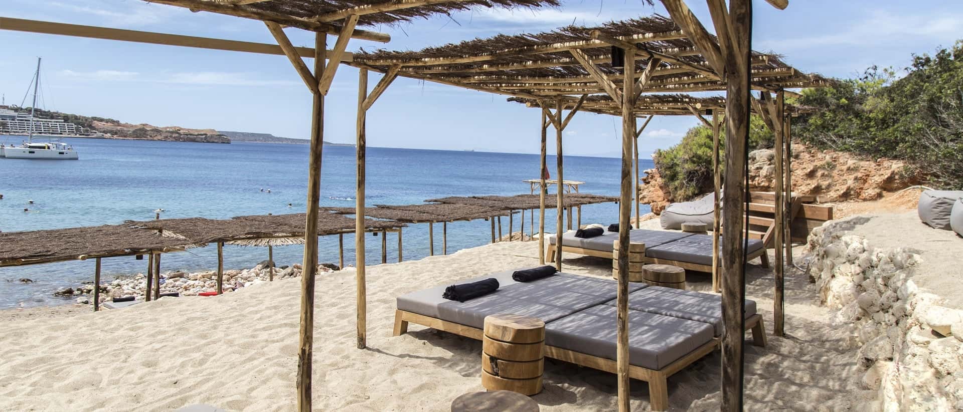 Vouliagmeni beach on the Athenian riviera, where an 82-year-old man suffered a fatal cardiac arrest after a sunlounger dispute escalated into a brawl witnessed by his wife.