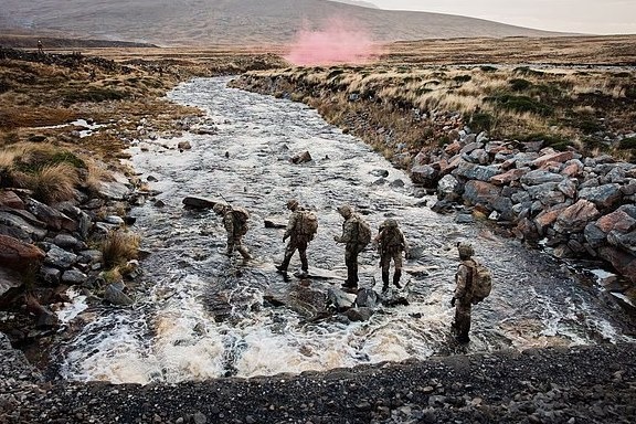 British soldiers cross a rocky stream in the Falkland Islands as Prime Minister Andy Burnham vowed to do 'whatever it takes' to keep the islands British.
