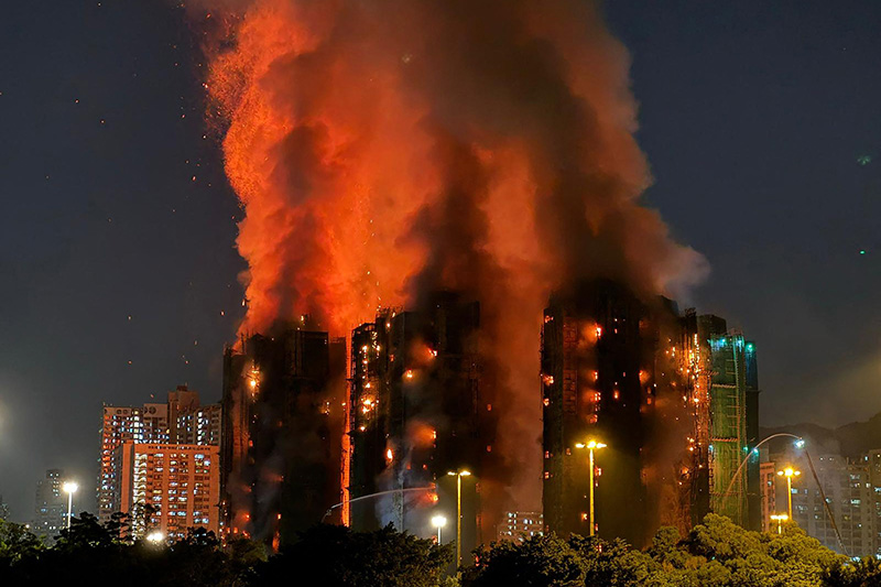 The gutted Wang Fuk Court complex in Tai Po following the November 2025 blaze that killed 168 people, whose displaced residents remain unable to return home almost a year on.