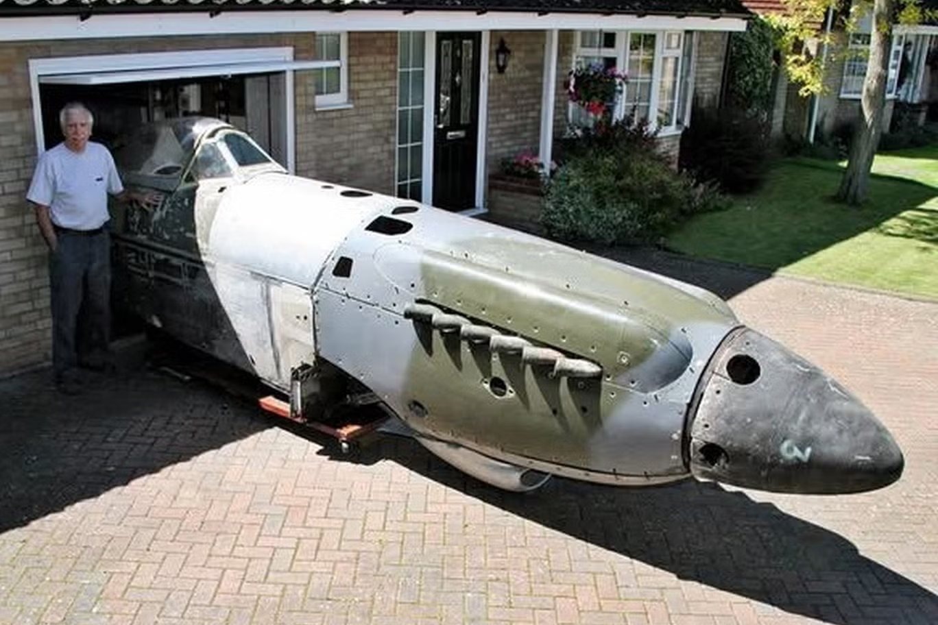 Peter Arnold, the Newport Pagnell aviation enthusiast who tracked down more than 260 surviving Spitfires across the globe, beside the Supermarine Spitfire F Mk 22 PK519 fuselage he kept for 20 years; it sold for £18,000…